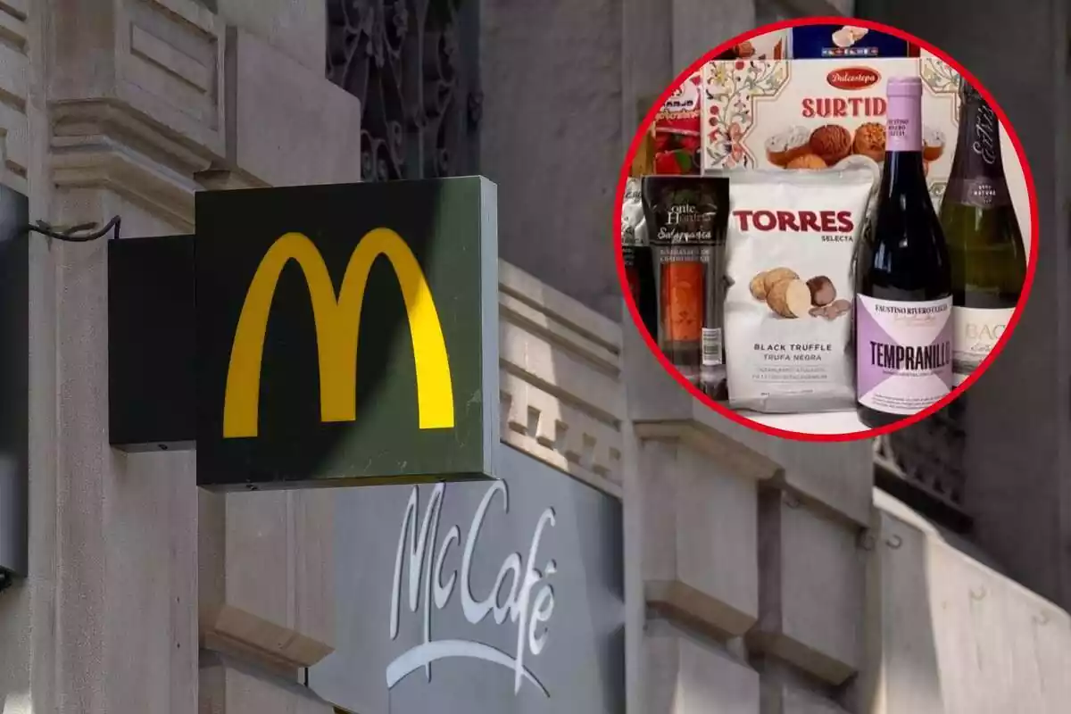 Fotomontaje con una imagen de fondo del cartel de un restaurante McDonald's en Barcelona y al frente una redonda roja con la cesta de Navidad de los empleados de la cadena